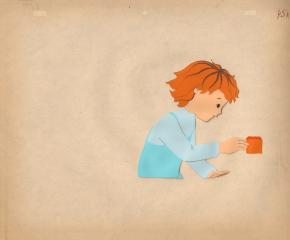 Мальчик держит в руке кубик. Фаза из мультфильма "Рыжая ворона"