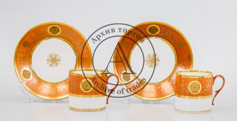Две чайные пары с оранжевым крытьем и росписью арабесками
